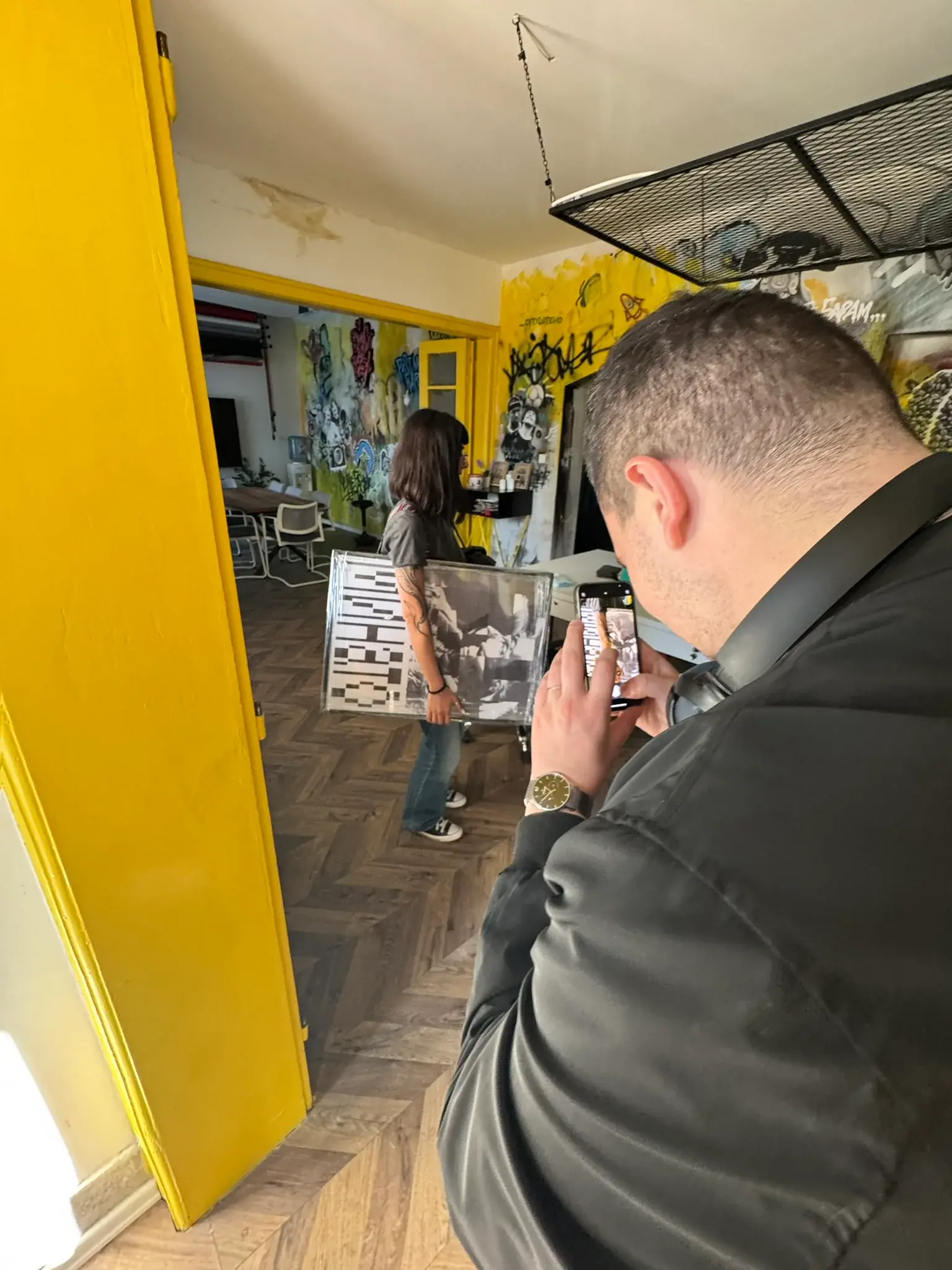 A Why Agency team member photographing artwork in the studio