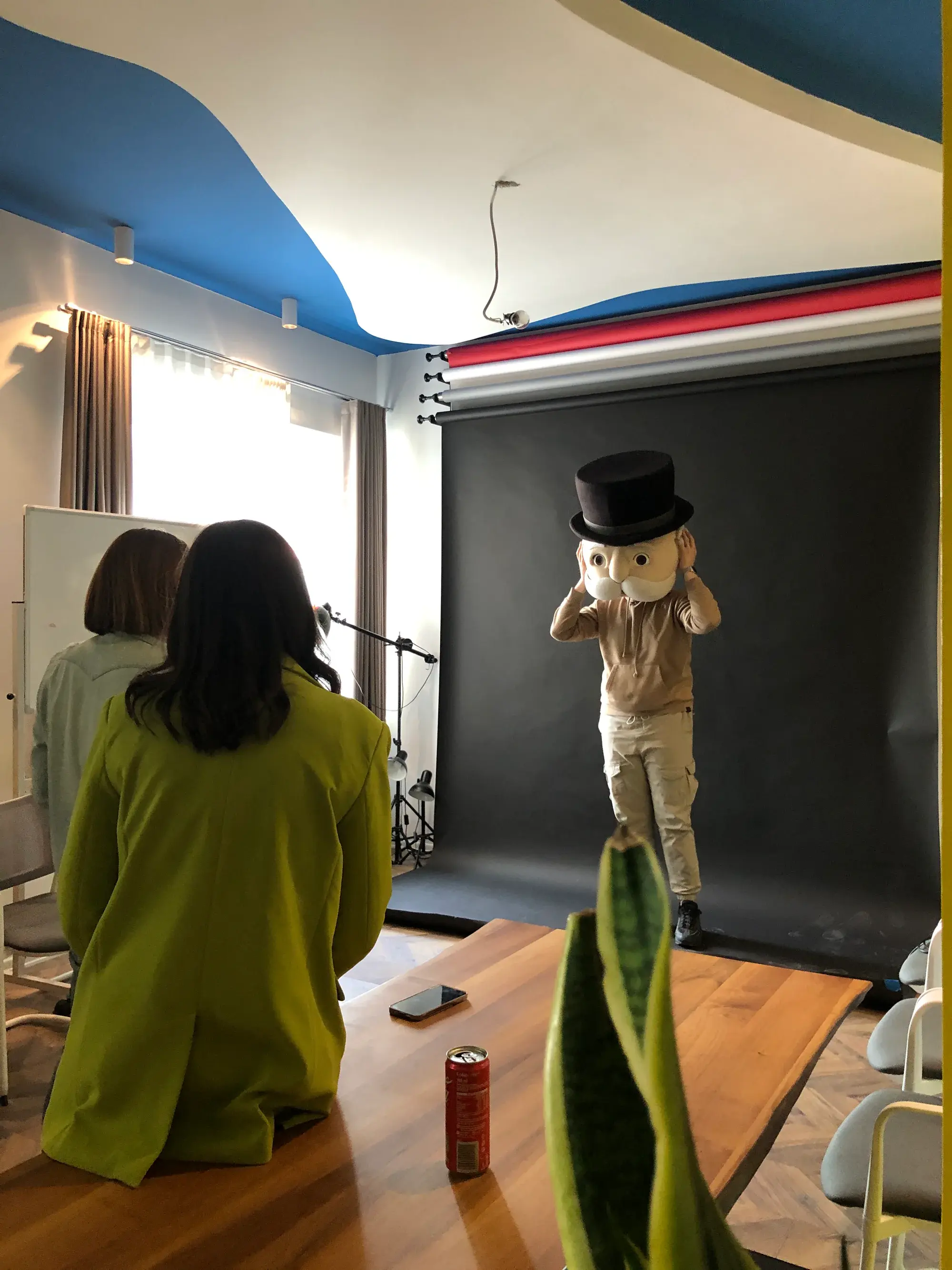 A Why Agency team filming a mascot in the studio