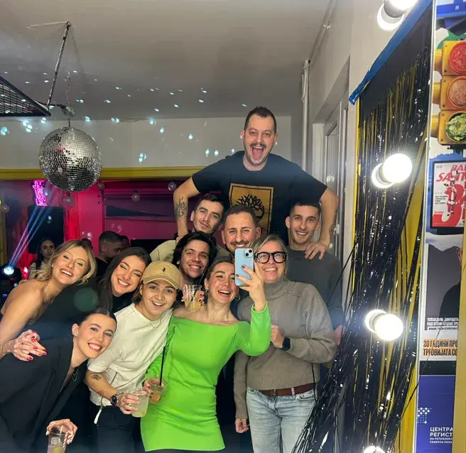 The Why Agency team celebrating together